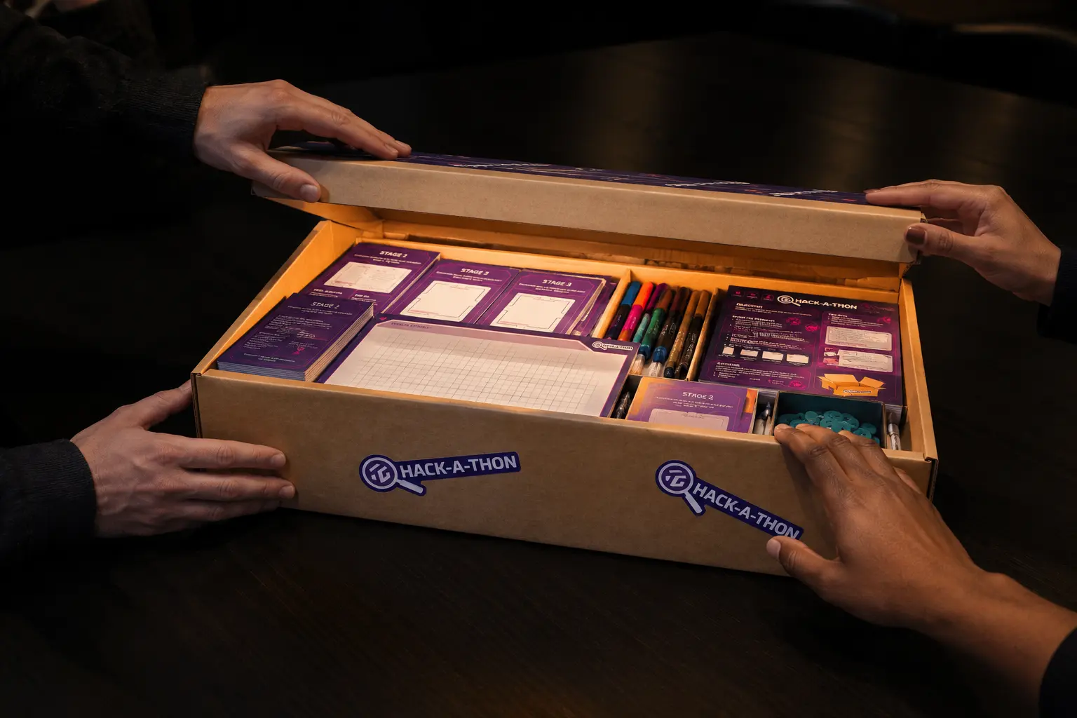 Hands opening the custom workshop materials box